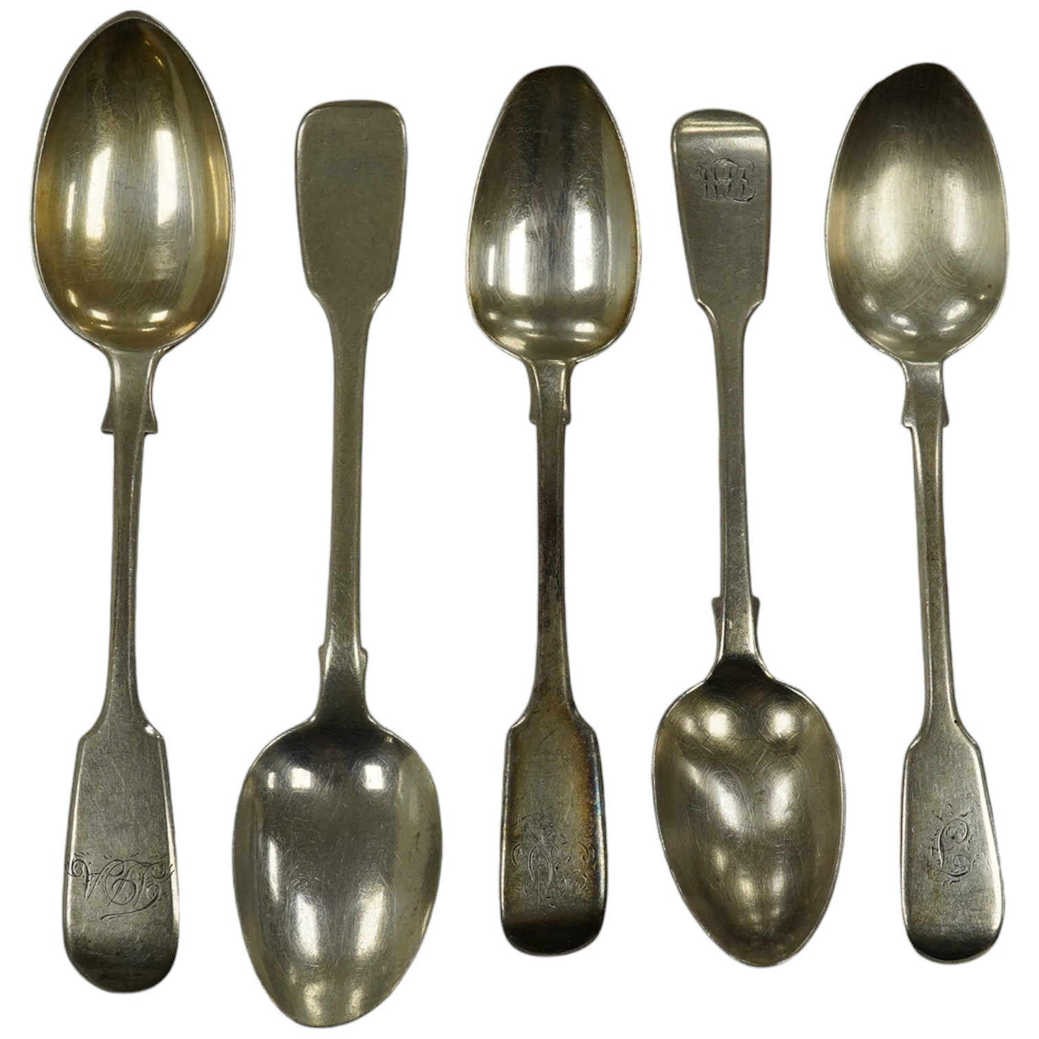 A harlequin set of thirty one William IV and later silver fiddle pattern tea spoons, various dates and makers, 20.9oz. Condition - poor to fair